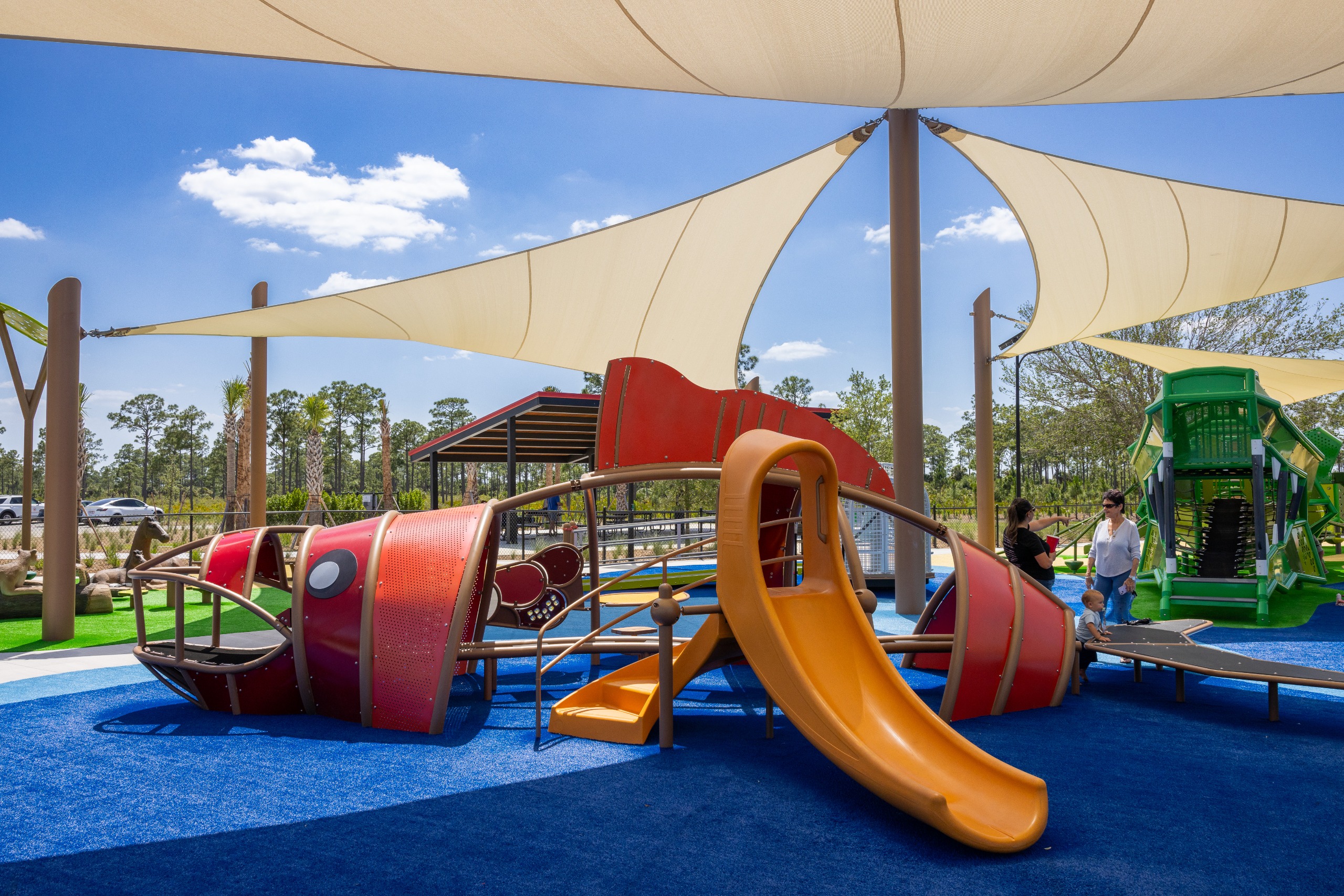 Example play structure of a fish with slide and climbing features. 